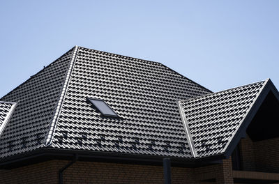 Low angle view of modern building against clear sky