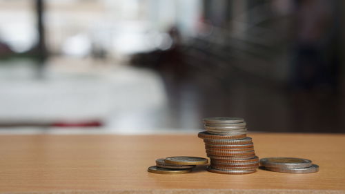 Close-up of coins on table