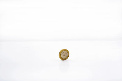 Close-up of coins on white background