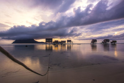 Scenic view of calm sea against cloudy sky