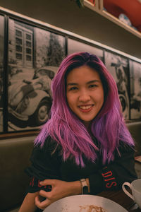 Purple hair asian woman expression