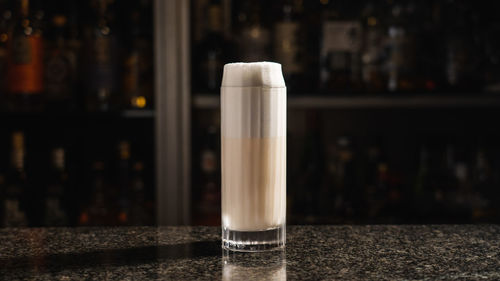 A ramos gin fizz cocktail on the marble bar