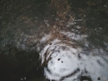 High angle view of water flowing in sea
