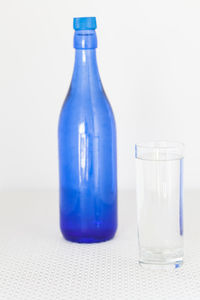 Close-up of empty glass bottle on table