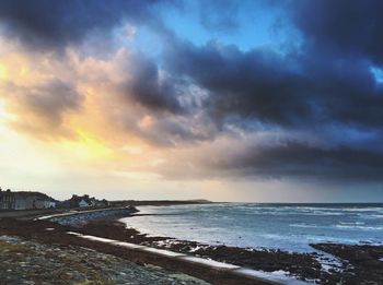 Scenic view of sea against sky at sunset