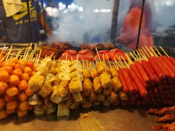 Night market atmosphere with smoky grilled food menu