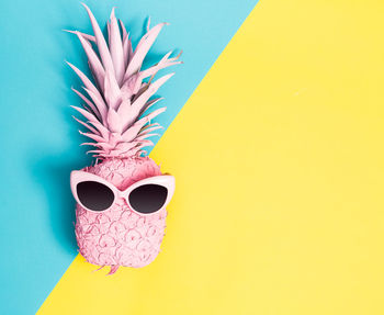 Close-up of sunglasses on pineapple