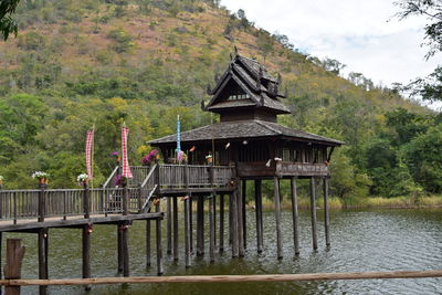 Gazebo by lake against building