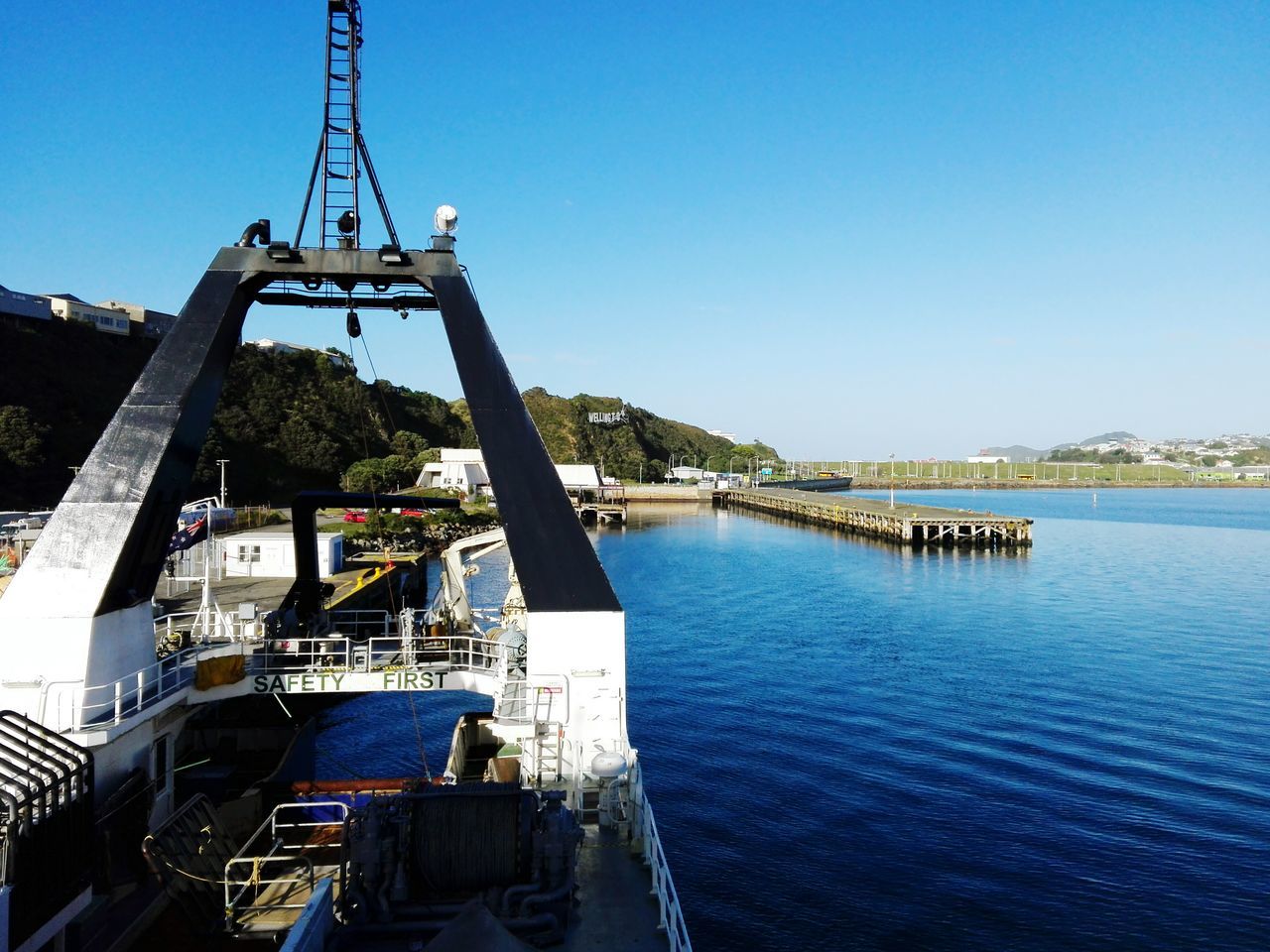 water, clear sky, blue, built structure, day, transportation, nautical vessel, real people, men, leisure activity, architecture, outdoors, lifestyles, nature, sea, sky, people