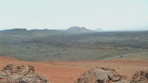 Scenic view of desert against clear sky
