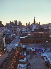 High angle view of street and buildings against sky