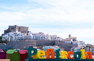 Panoramic shot of buildings against sky in city