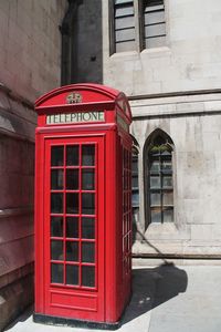Red telephone booth in building
