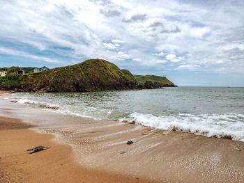 Scenic view of beach against sky
