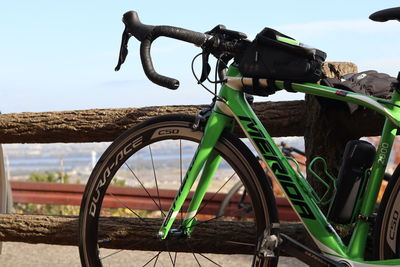 Close-up of bicycle parked on field