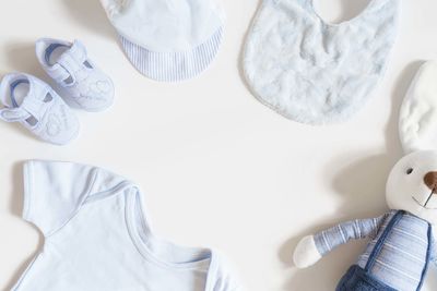 High angle view of hat on table against white background