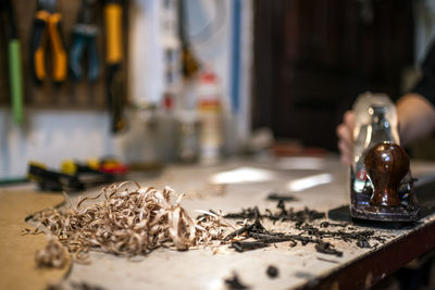 Unrecognized luthier woman in traditional workshop