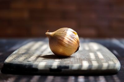 Close-up of onion on cutting board