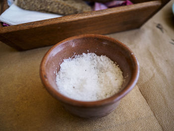 Close-up of salt in bowl on table