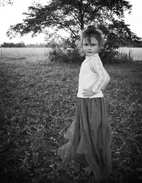 Cute girl standing on field