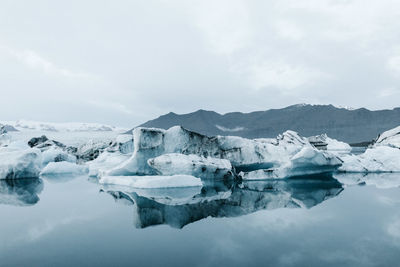 Scenic view of snow covered landscape against sky