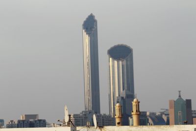 Low angle view of buildings in city against sky