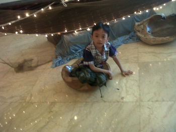 Full length of girl standing in illuminated room