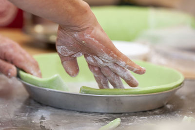 Close-up of person preparing food