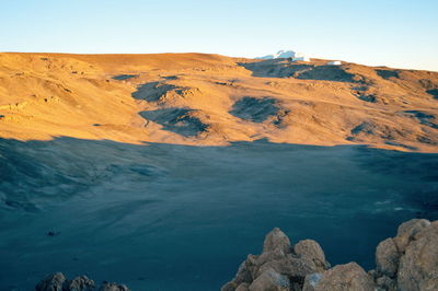 Scenic view of rocky mountains against clear blue sky, mount kilimanjaro, tanzania 