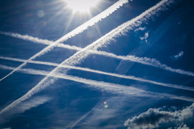 Low angle view of vapor trails in sky