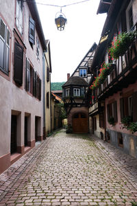 Footpath amidst buildings in town