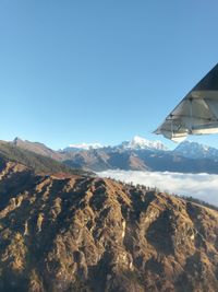 Scenic view of mountains against clear blue sky