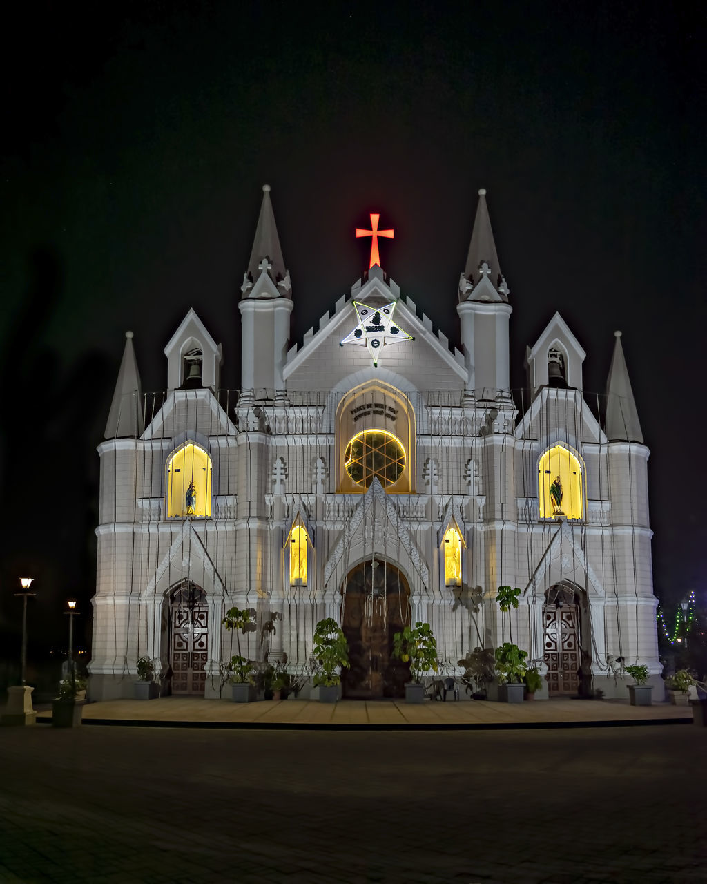 architecture, building exterior, night, built structure, place of worship, religion, building, belief, illuminated, spirituality, travel destinations, no people, nature, sky, catholicism, landmark, facade, city, worship, outdoors, the past, light, history