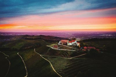 High angle view of agricultural landscape against sky during sunset