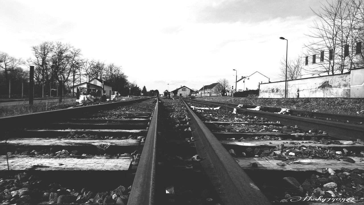 railroad track, rail transportation, transportation, sky, outdoors, day, tree, no people, architecture