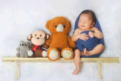 Full length of cute baby with toy