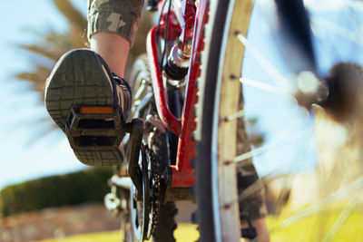 Low section of man holding steering wheel