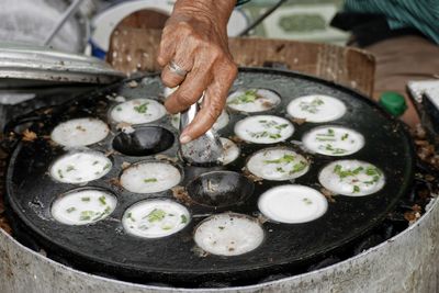 High angle view of man preparing food