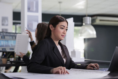 Businesswoman working on table