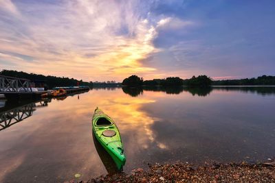 Scenic view of lake against sky during sunset