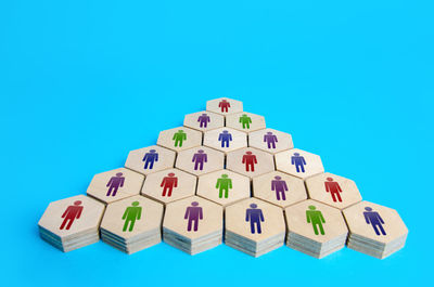 Low angle view of toy blocks against blue background