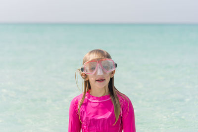 Portrait of girl standing at beach