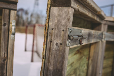 Metallic latch on wooden door