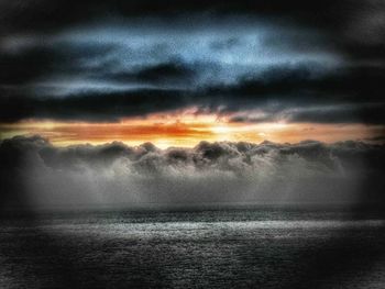 Scenic view of sea against cloudy sky