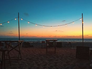 Scenic view of beach against sky during sunset