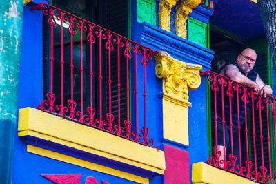 Portrait of man on railing