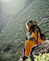 Woman standing on rock