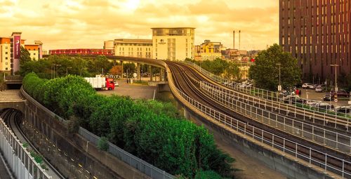 High angle view of railway bridge in city against sky