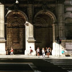 People walking in historic building