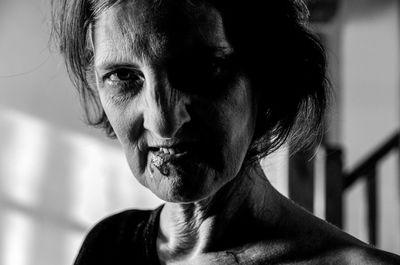 Close-up portrait of angry senior woman